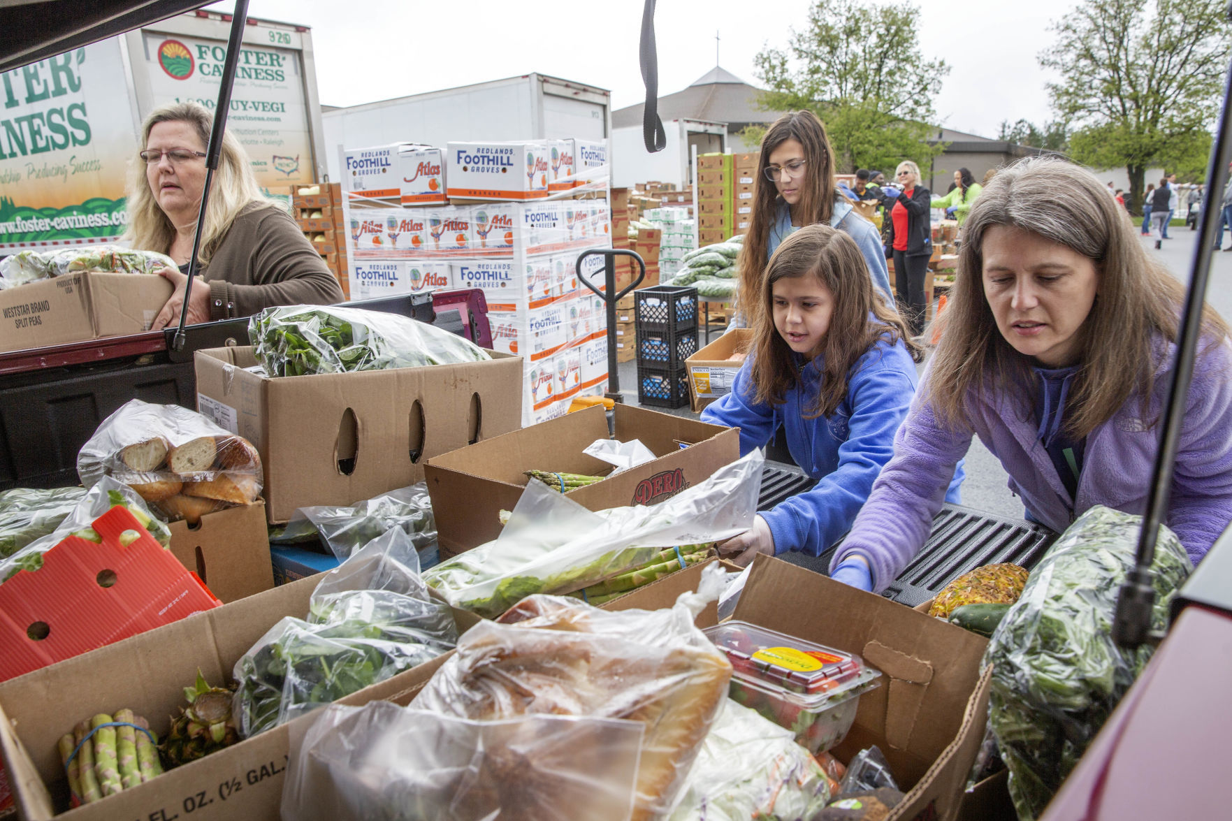 Crowds flock to produce giveaway at Daystar Church